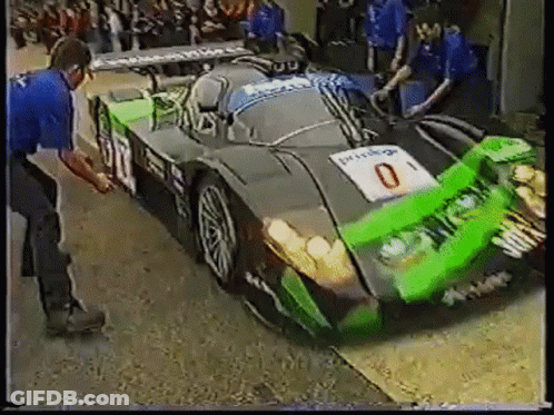 Green And Black Race Car With Number 0 GIF