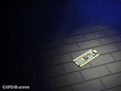 Green And Gold Motherboard On Black Brick Floor GIF