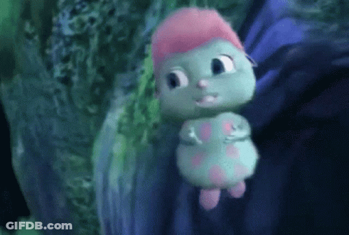 Green And Pink Cartoon Character With Headband GIF