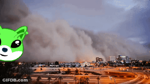 Green And White Cat In Front Of Dust Cloud GIF