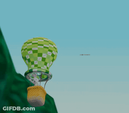 Green And White Hot Air Balloon Over Hill GIF