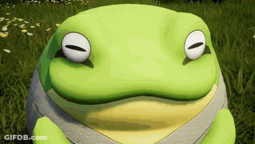 Green And Yellow Frog Sitting In Grass GIF