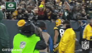 Green Bay Packers Player Escorted By NFL Security Guard GIF