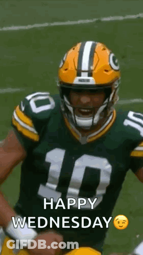 Green Bay Packers Player Holding Fist In Air With Helmet GIF