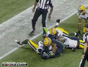 Green Bay Packers Player Laying On Field GIF