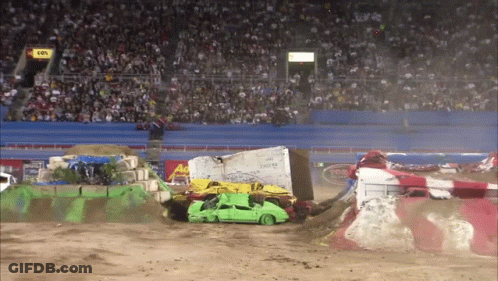 Green Car Destroyed By Monster Truck In Dirt Race GIF