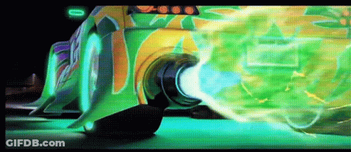 Green Car With Graffiti Driving Down Road GIF