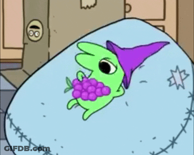Green Cartoon Character In Purple Hat Eating Grapes GIF
