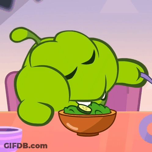 Green Cartoon Character Sitting At Table With Bowl Of Food GIF