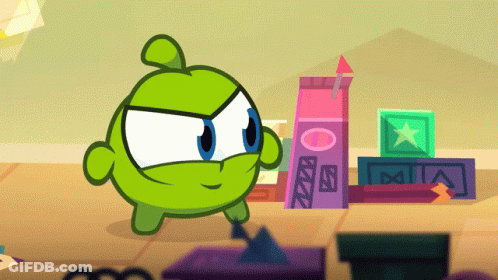 Green Cartoon Character Standing In Front Of Letter A Blocks GIF