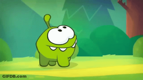 Green Cartoon Character Standing In Grass GIF