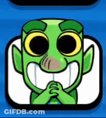 Green Cartoon Character With Big Eyes And Big Smile Sitting GIF