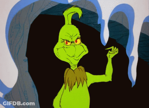 Green Cartoon Character With Red Eyes Standing In Front Of Cave GIF