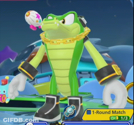 Green Cartoon Holding Balloon In Mouth GIF