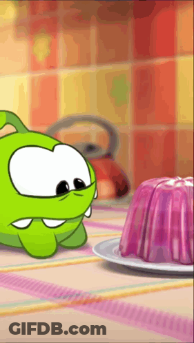 Green Cartoon Looking At Purple Pudding GIF