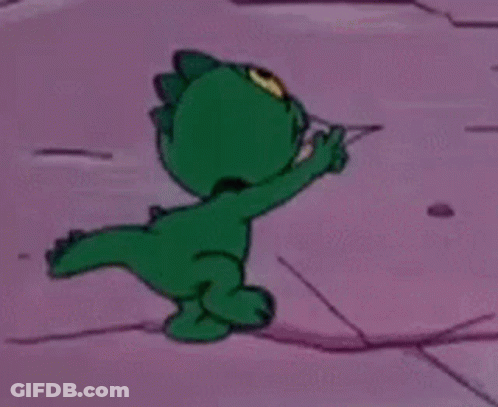 Green Cartoon Pointing On Pink Surface GIF