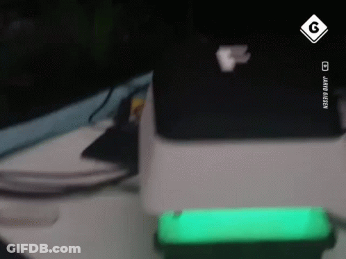 Green Cell Phone Next To Laptop And Sign Saying G GIF