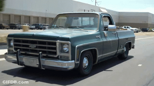Green Chevy Truck Parked In Front Of Building Number 1234 GIF