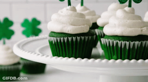 Green Cupcakes With White Frosting And Shamrocks GIF