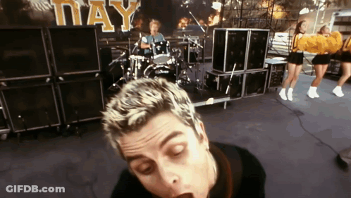 Green Day Performing With Cheerleaders GIF