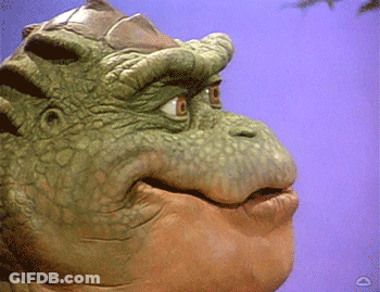 Green Dinosaur Face Purple Background GIF