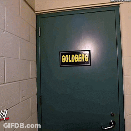 Green Door With Goldberg Sign GIF