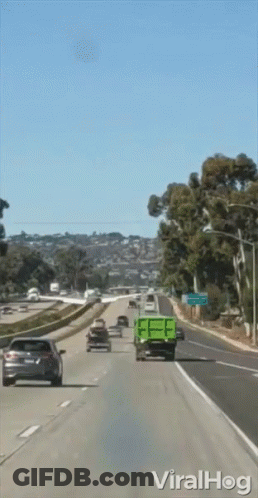 Green Dump Truck On Highway With Viralhog Sign GIF