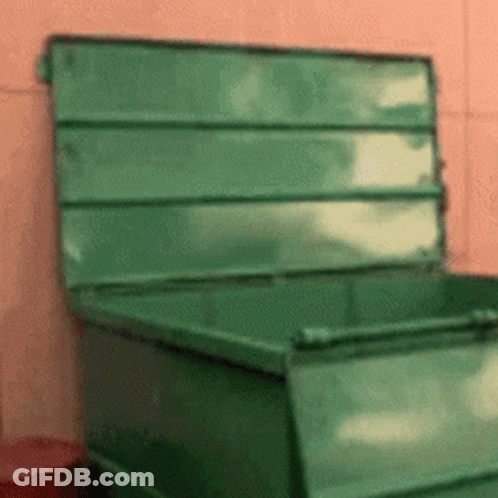 Green Dumpster With Open Lid On Pink Wall GIF