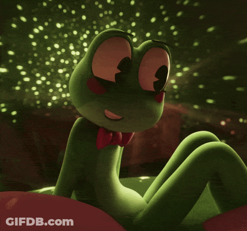 Green Frog In Red Bow Tie Looking At Camera GIF