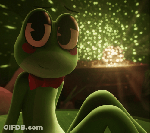 Green Frog In Red Bow Tie Sitting On Bed GIF