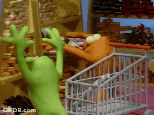 Green Frog Reaching For Something In Store GIF