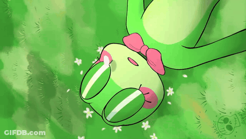 Green Frog With Pink Bow Laying In Grass GIF