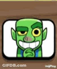 Green Goblin Smiling On Wooden Table GIF