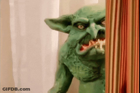 Green Goblin Statue With Toothbrush GIF