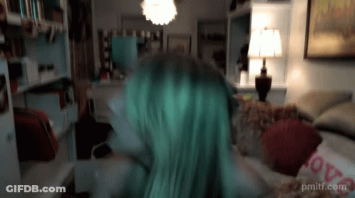 Green Hair Woman On Couch With Love Pillow GIF