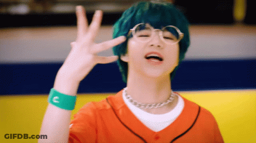 Green-Haired Boy, Glasses, Orange Shirt, Green C Wristband GIF