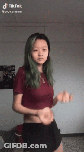 Green Haired Dancing Girl Red Shirt Black Shorts GIF