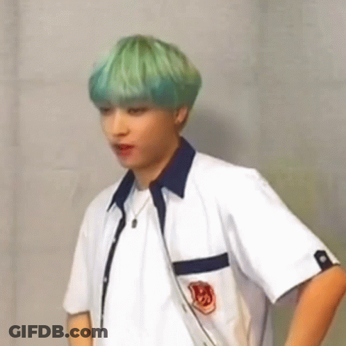 Green-Haired Man White Shirt Hands On Hips GIF