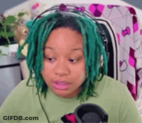 Green-Haired Woman In Green Shirt And Headphones GIF