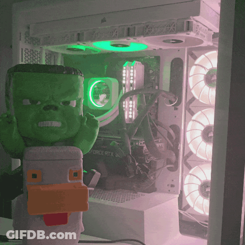 Green Hulk Figurine In Front Of Corsair RTX 30 Motherboard GIF