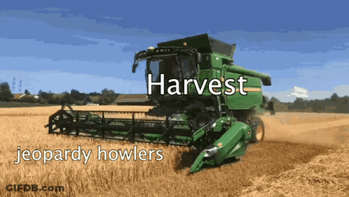 Green John Deere Combine Harvester In Wheat Field GIF