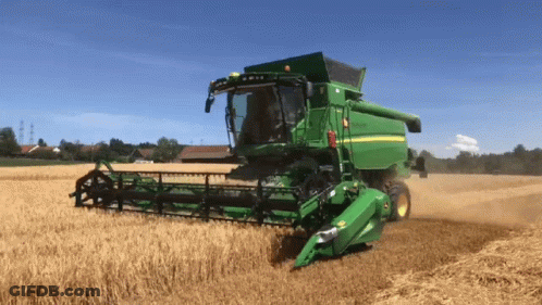 Green John Deere Combine Harvester In Wheat Field GIF