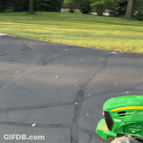 Green John Deere Tractor Parked On Road GIF