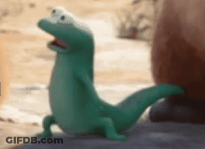Green Lizard Standing On Rock GIF