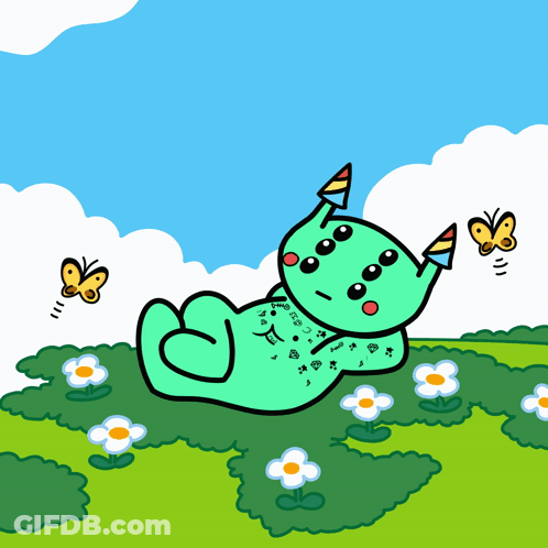 Green Monster Laying In Grass GIF