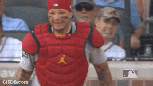 Green Monster Mascot Sitting In Stands GIF