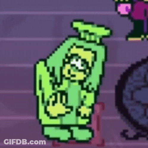 Green Monster Standing Next To Pink Chair GIF