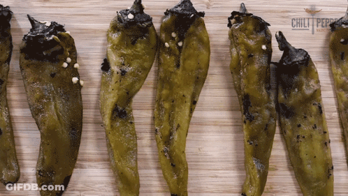 Green Peppers On Wooden Board With Chili Logo GIF