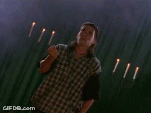 Green Power Ranger Standing In Front Of Dark Background GIF