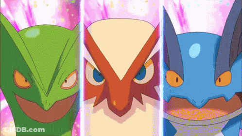 Green, Red, And Blue Owls Standing Together GIF